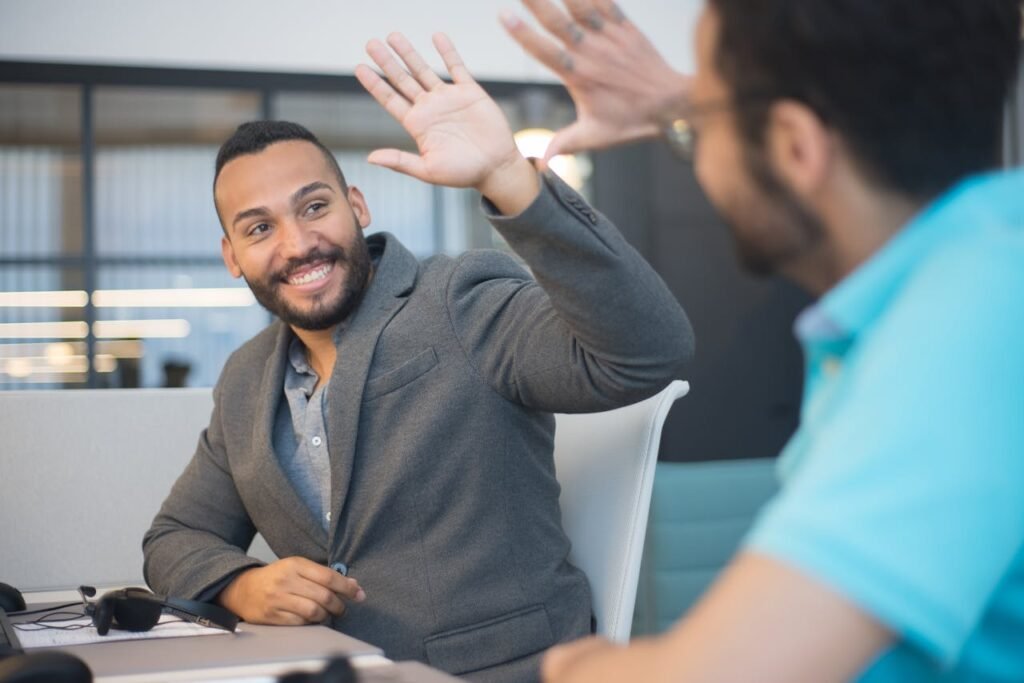 Happy Office Workers Making High Five Gesture